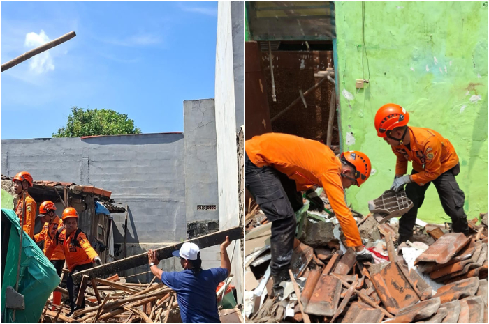 Petugas BPBD Kabupaten Bogor saat membantu menangani rumah pasca ambruk di Kampung Cikaret, Cibinong.