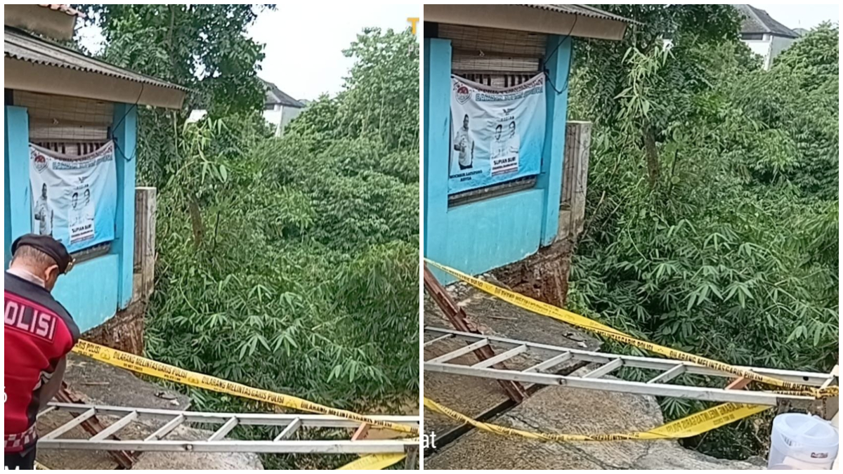 Polisi memasng garis polisi di lokasi longsor rumah kontrakan di Beji Kota Depok.