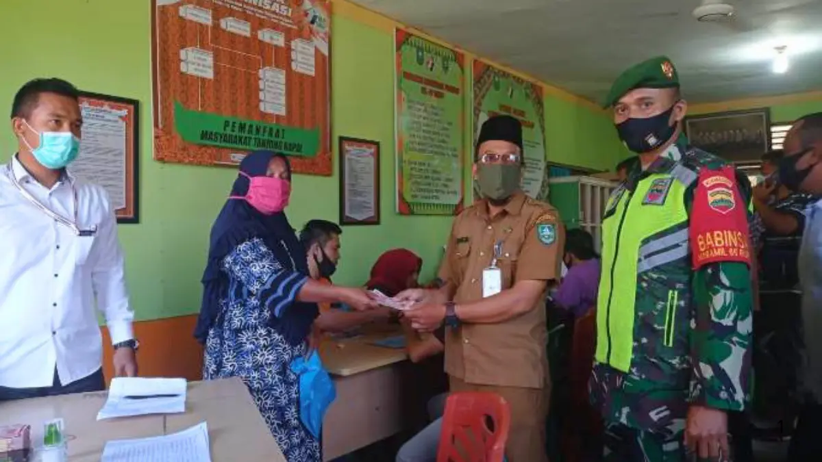 Ilustrasi Penyerahan dana bansos (Foto: camatrupat.bengkaliskab.go.id)