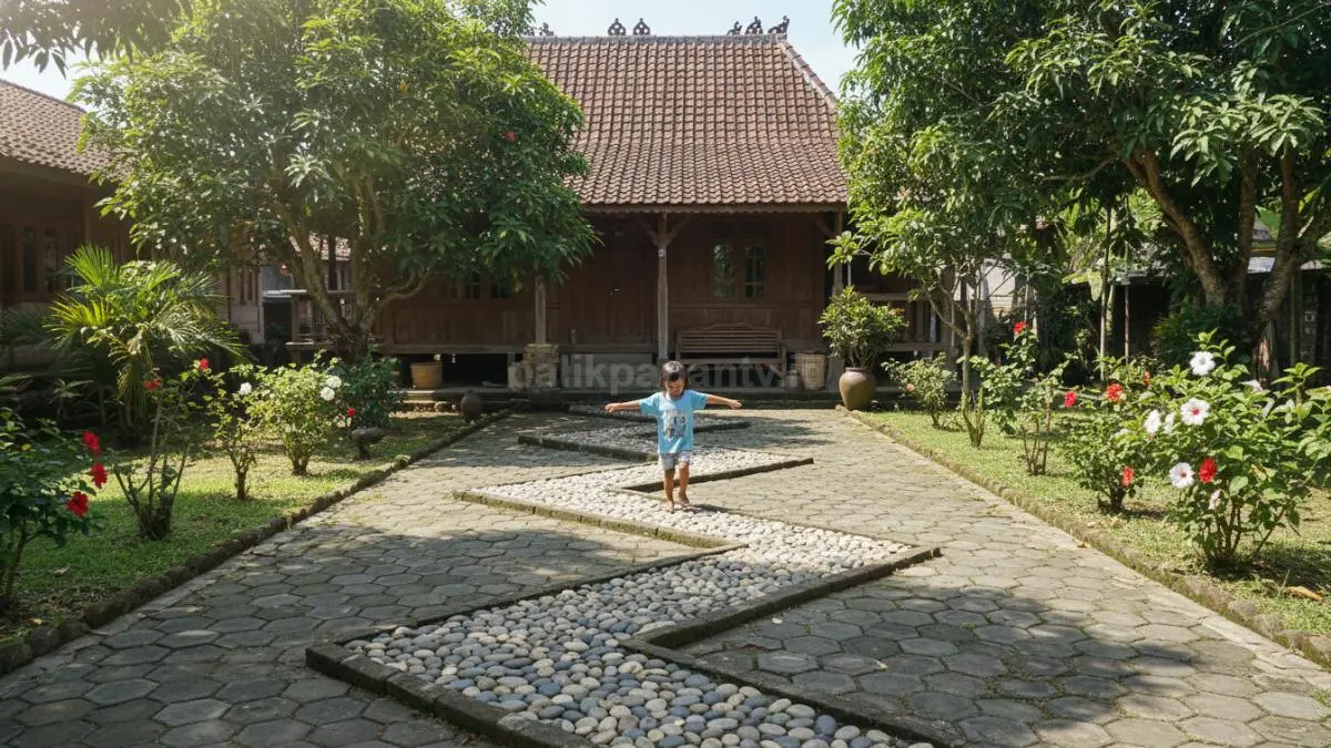 Susunan batu atau paving di halaman membentuk jalur zig-zag, digunakan anak untuk berjalan melatih keseimbangan.