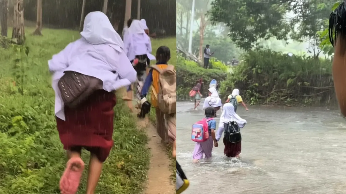 Siswa SD berlari di tengah hujan menuju sungai demi pulang sekolah