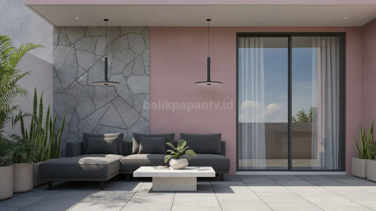 Kombinasi dinding pink dusty dan batu alam pada teras rumah minimalis modern.
