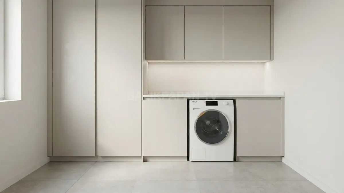Kabinet tanam modular dari material tahan air menyembunyikan instalasi pipa agar ruangan laundry rapi. (BTV/Ai)