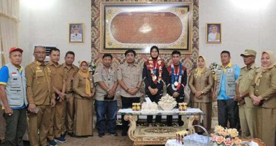 Kepulangan kedua atlit disambut pemerintah dan masyarakat Kabupaten Pohuwato (F:humas Pemkab Pohuwato)