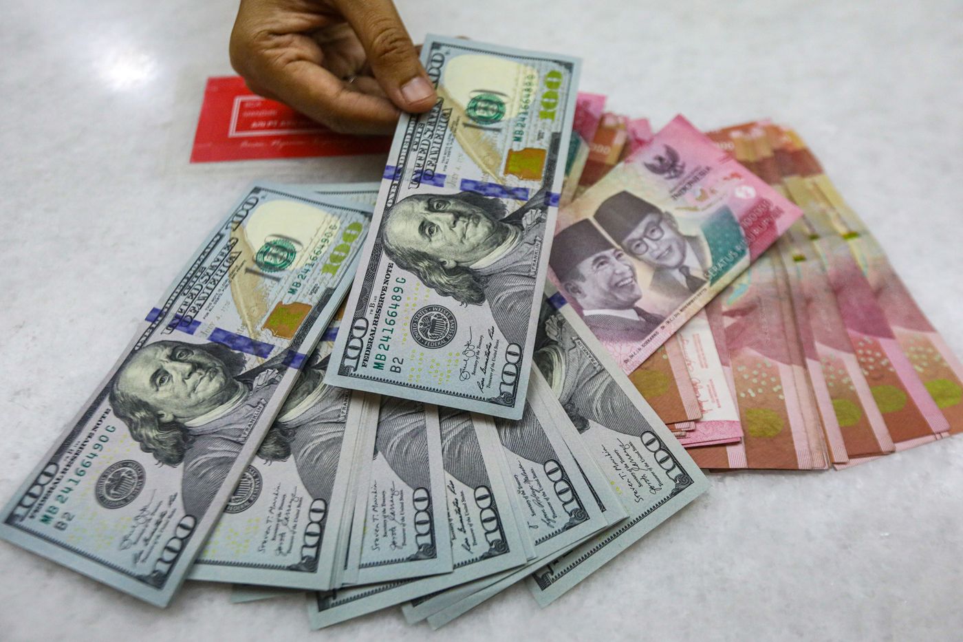 Ilustrasi mata uang rupiah terhadap dolar AS. (Dok. JawaPos.com)