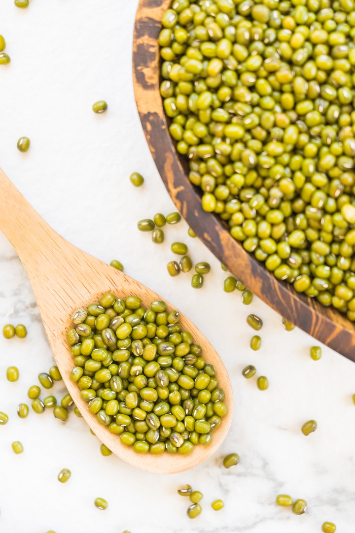 Green mung beans in wooden bowl - Healthy and nutririon food concept style