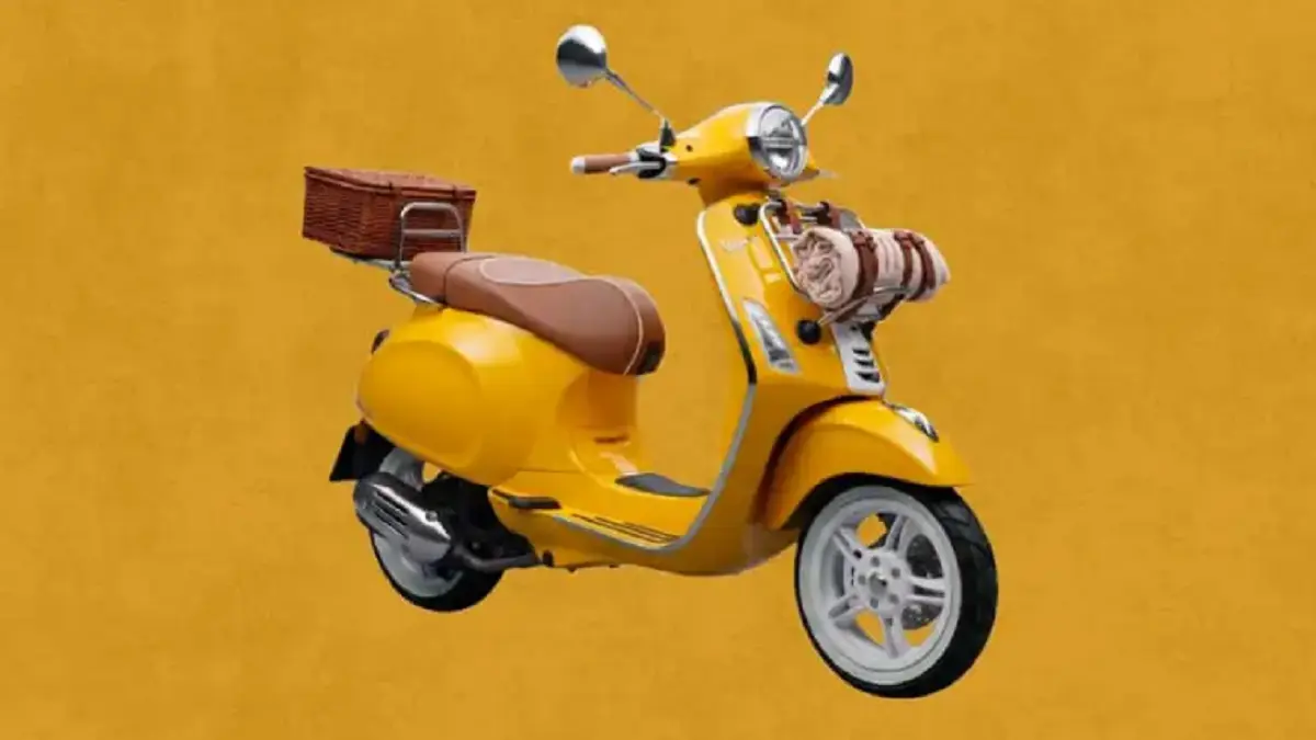 Vespa Primavera 125 edisi Gigi tampil dengan warna kuning cerah, jok kulit, rak krom, dan keranjang piknik. (VESPA)