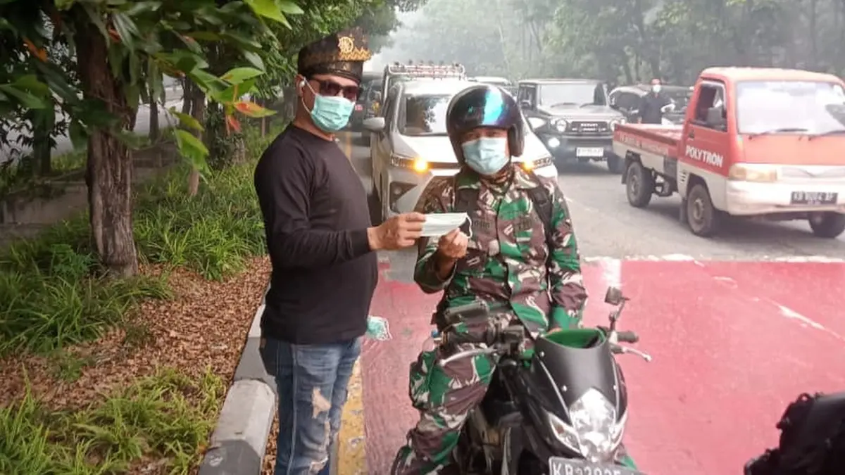 Pengurus BPM bergerak dibanyak titik membagikan 22 ribu masker bagi warga Kota Pontianak dan wilayah lainnya di Kalbar. (ISTIMEWA)