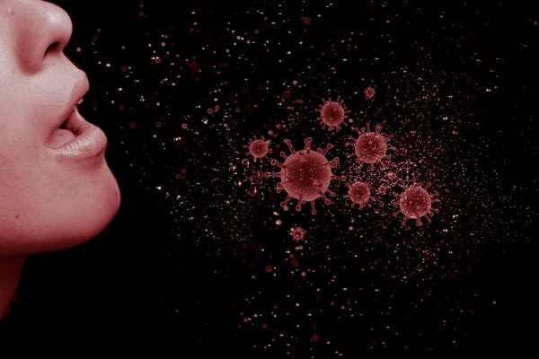 Ilustrasi seseorang berbicara dan mengeluarkan partikel virus di udara (Pixabay)