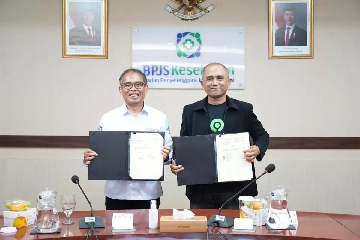 Penandatangah kerja sama BPJS Kesehatan dan PT GoTo Gojek Tokopedia Tbk untuk memastikan pekerja transportasi online memperoleh akses perlindungan kesehatan yang berkelanjutan, Senin (12/1/2025).