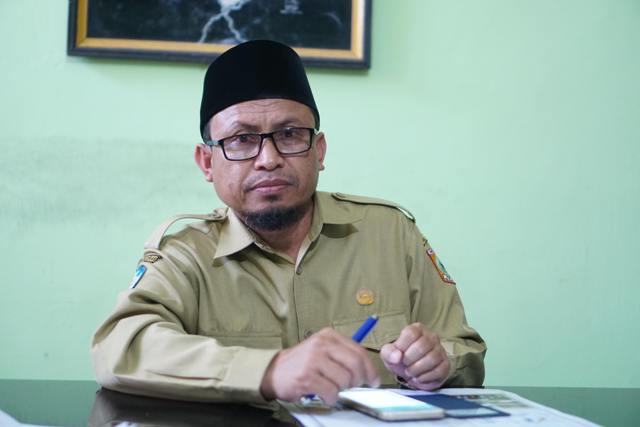 Kepala Dinas Dikbud Lotim Izzudin (Dok Lombok Post)