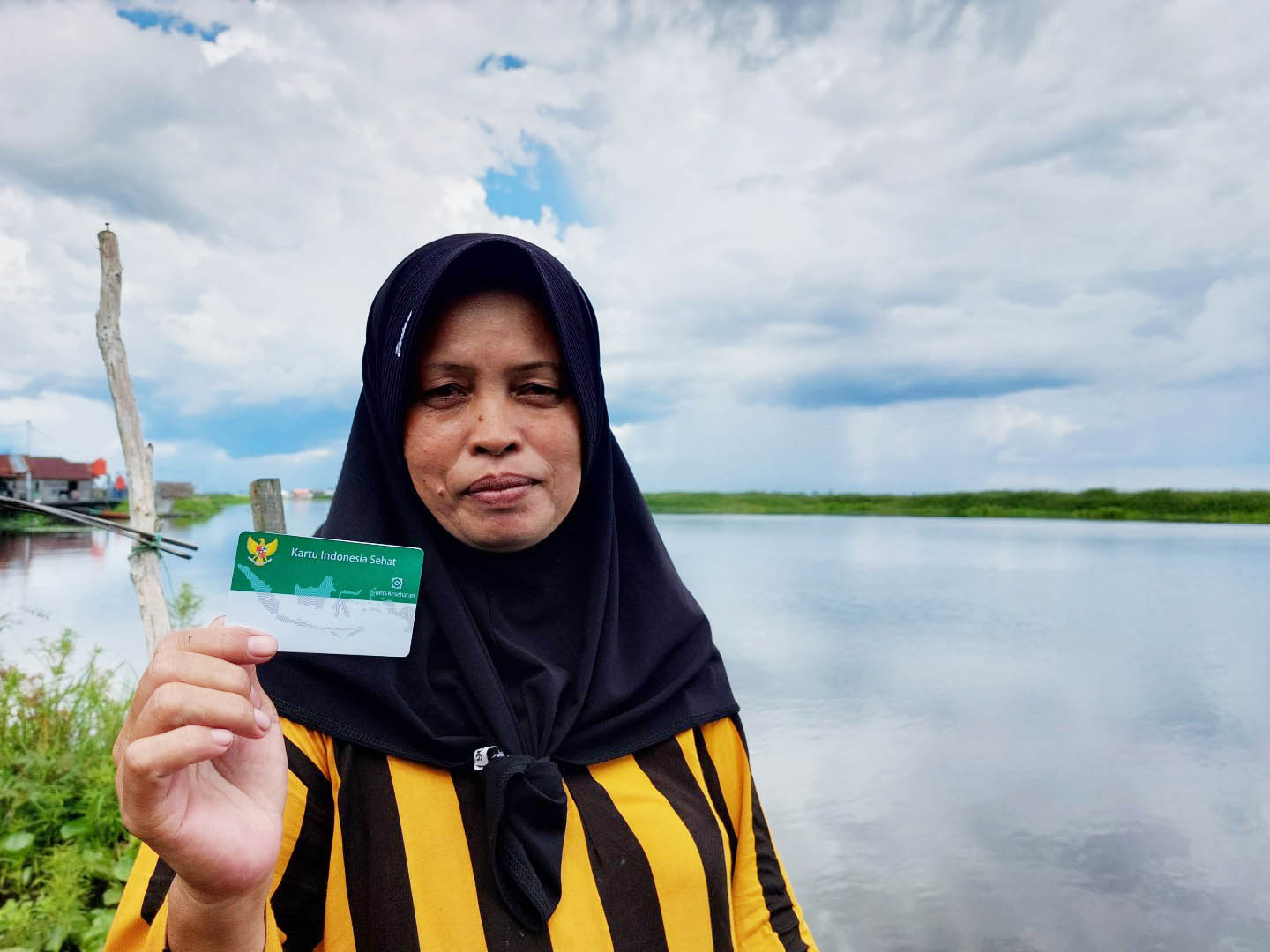 TERBANTU: Hamida (39) warga Desa Sungai Buluh, Kecamatan Labuan Amas Utara, Hulu Sungai Tengah, Kalimantan Selatan terbantu kehadiran JKN.
