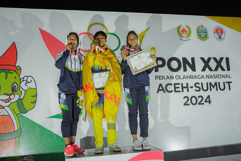 PECAH REKOR: Pelari Kalsel Dina Aulia kembali tampil memukau dengan persembahkan emas kedua di cabor atletik.