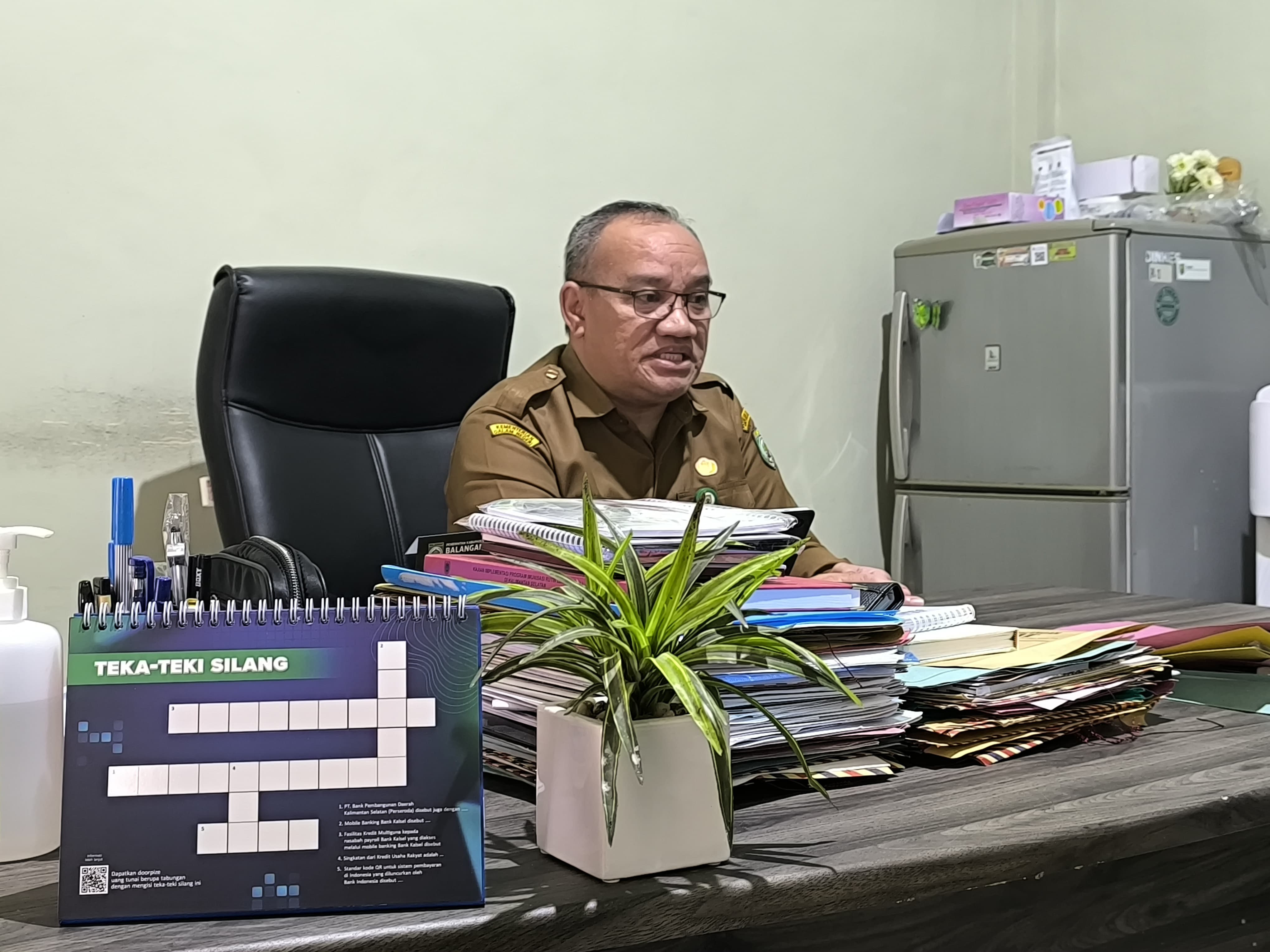 JELASKAN:Plt Kadinkes Kabupaten Balangan, H Ahmad Sauki menjelaskan panduan menu PMT sesuai kebutuhan gizi anak.(Foto:M Dirga/ Radar Banjarmasin)