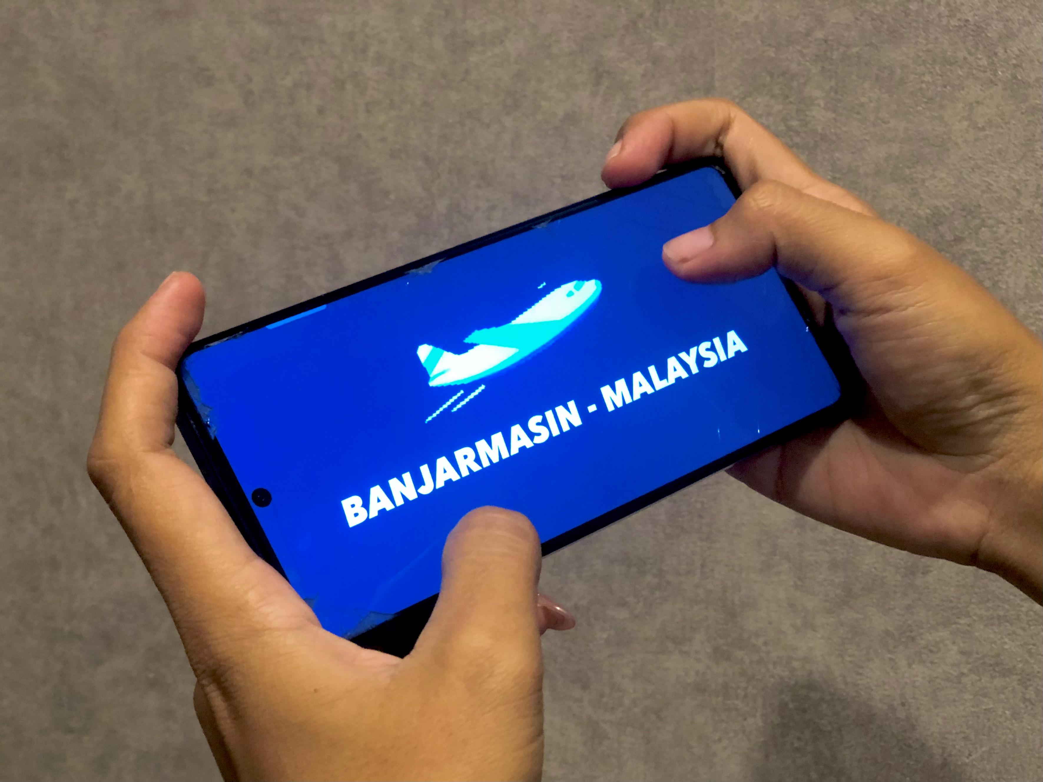 BOOKING:Ilustrasi laman pemesanan tiket pesawat rute penerbangan langsung Banjarmasin-Kuala Lumpur Malaysia.(Foto:Tia Lalita Novitri/Radar Banjarmasin)