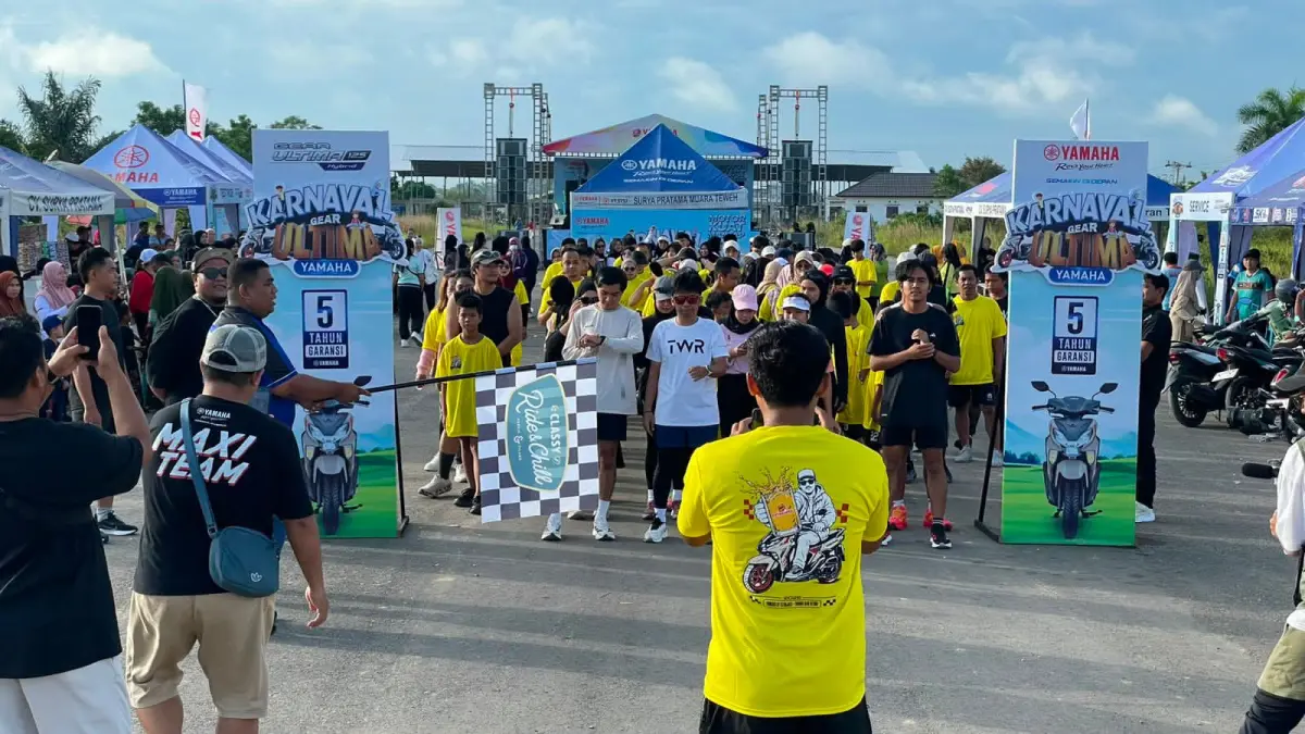 MERIAH: Jalan santai berhadiah menjadi salah satu kegiatan yang menarik dan banyak diikuti peserta di event Karnaval Yamaha Gear Ultima di Muara Teweh, belum lama tadi.
