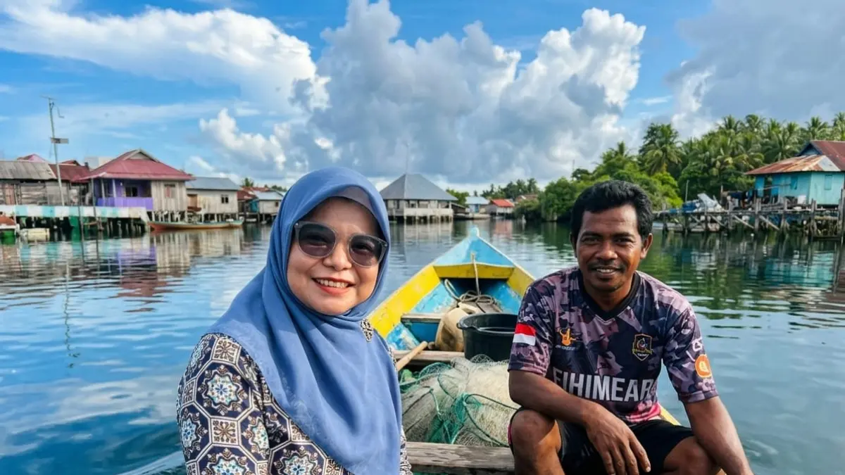  seorang Mantri BRI dari Unit Wangi-Wangi, Kantor Cabang BRI Baubau.