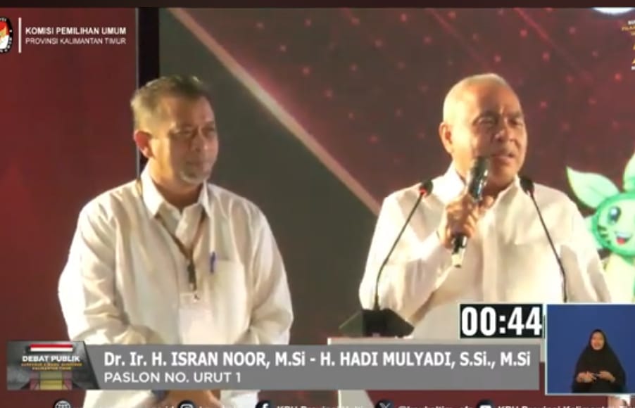 Isran dan Hadi saat debat perdana. (Tangkapan layar)