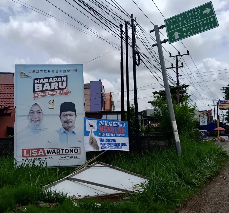 Spanduk ajakan menolak mencoblos kotak kosong yang dipasang di Jalan Trikora, Banjarbaru. (Sheilla Farazela/ Radar Banjarmasin)