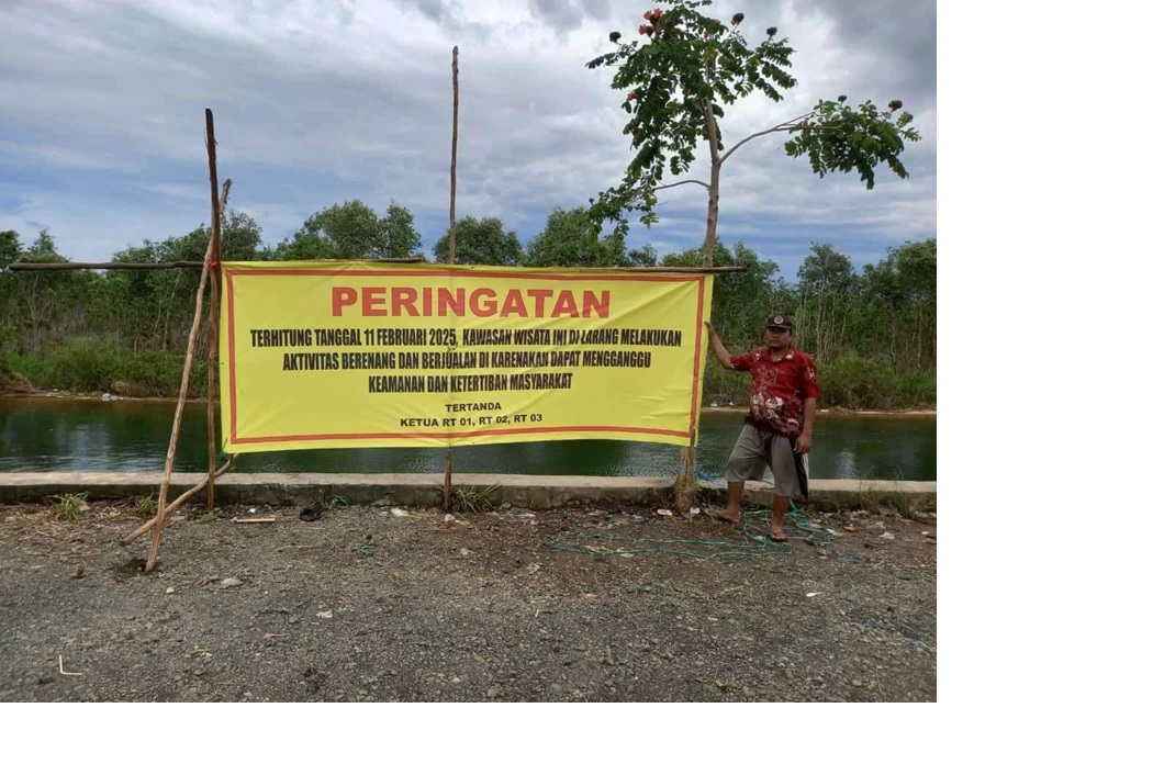 DILARANG: Spanduk berisi larangan adanya aktivitas di Jalan Baruh, Kelurahan Landasan Ulin Selatan. (HENDRA UNTUK RADAR BANJARMASIN)