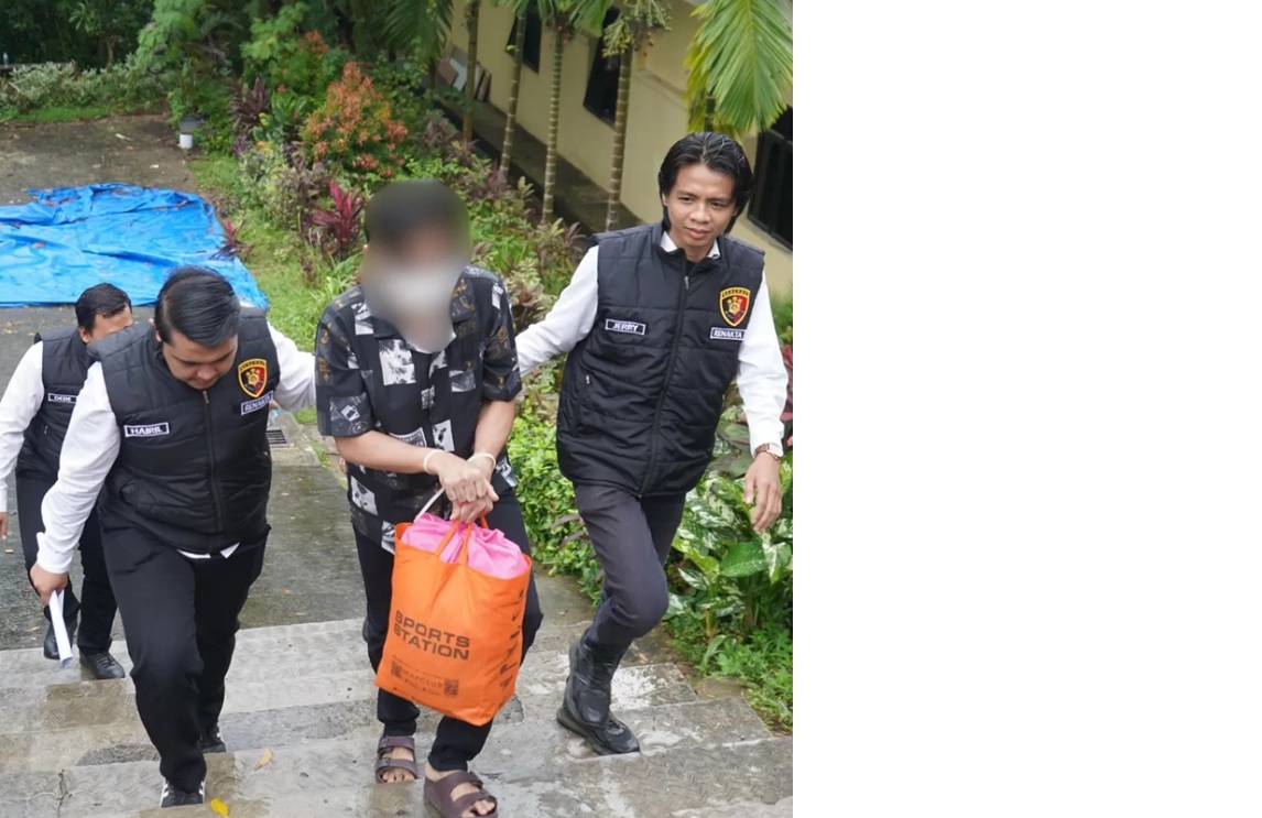 ASUSILA: Tersangka pencabulan anak kandung digiring petugas Polda Kaltim untuk dibawa ke Kejaksaan Negeri Balikpapan. (Bid Humas Polda Kaltim)