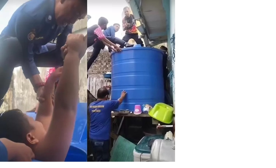 Personel penyelamatan Disdamkartan Nunukan ketika berusaha mengevakuasi bocah 12 tahun dari dalam profil tangki air