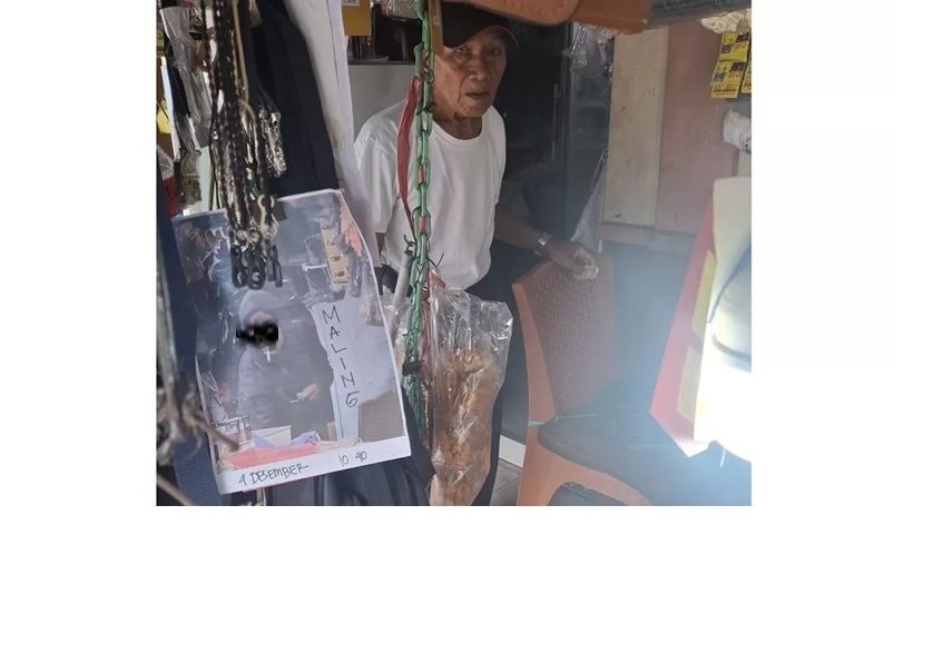 Wajah terduga pelaku pencuri terpampang di sebuah warung di Jalan S Parman, Sampit, Senin (8/12). FAHRY/RADAR SAMPIT