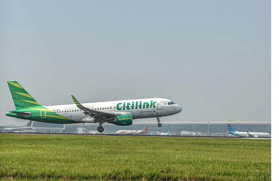 Ilustrasi pesawat Citilink. Tiket pesawat ke Denpasar selsiih tipis ke luar negeri. (Hanung Hambara/Jawa Pos)