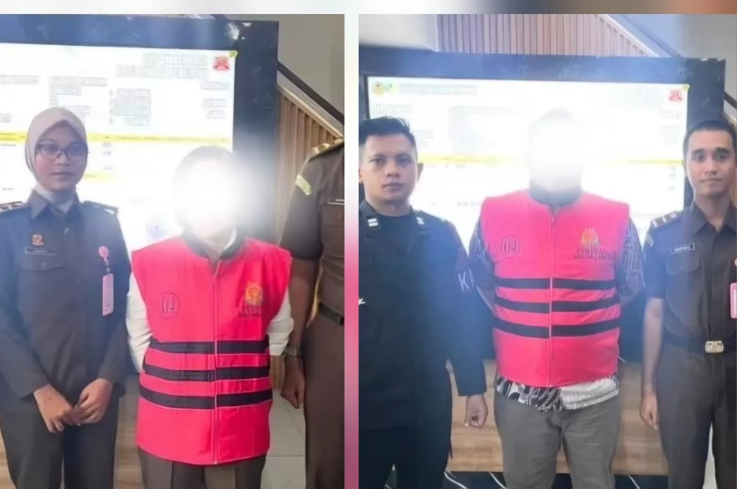 Dua tersangka kasus dugaan tindak pidana perpajakan saat pelimpahan tahap II di Kejaksaan Negeri Balikpapan.