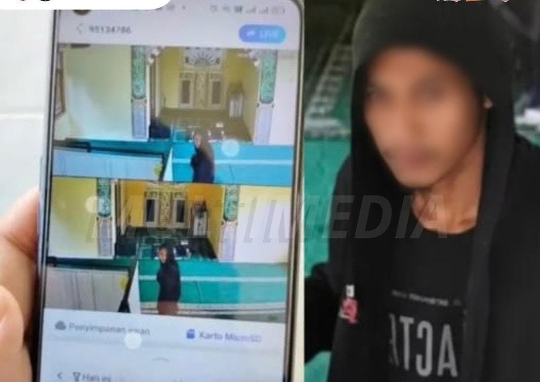 Tersangka saat terekam kamera.