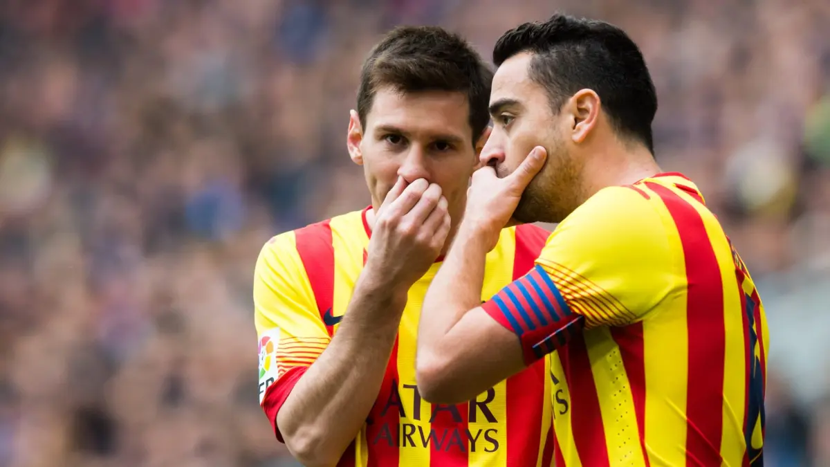 Messi dan Xavi saat bermain di Barcelona.