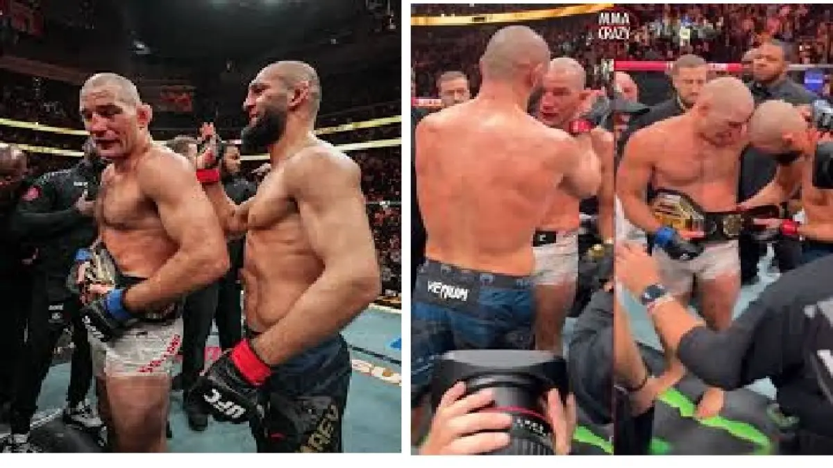 Khamzat memasangkan sabuk juara ke pinggang Sean Strickland.