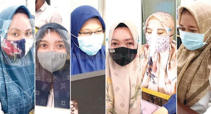 HINDARI VIRUS: Para pegawai Pemko Banjarbaru saat kembali ngantor setelah proses sterilisasi yang meliburkan para PNS selama dua hari. | FOTO: SUTRISNO/RADAR BANJARMASIN
