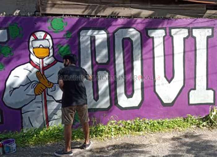 KREATIF: Salah satu mural dukungan penanganan Covid-19 di Banjarmasin, beberapa waktu lalu.