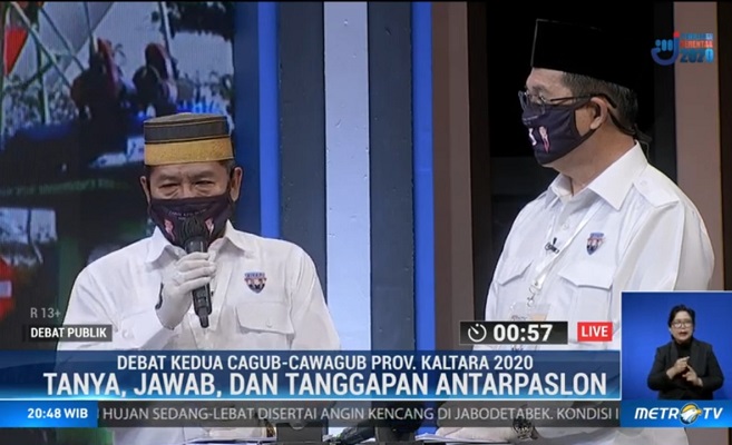 ADU PROGRAM: Calon Gubernur dan Wakil Gubernur Kalimantan Utara (Kaltara), Drs H. Zainal Arifin Paliwang, SH, M.Hum - Dr Yansen, TP, M.Si menympaikan closing statement debat publik.