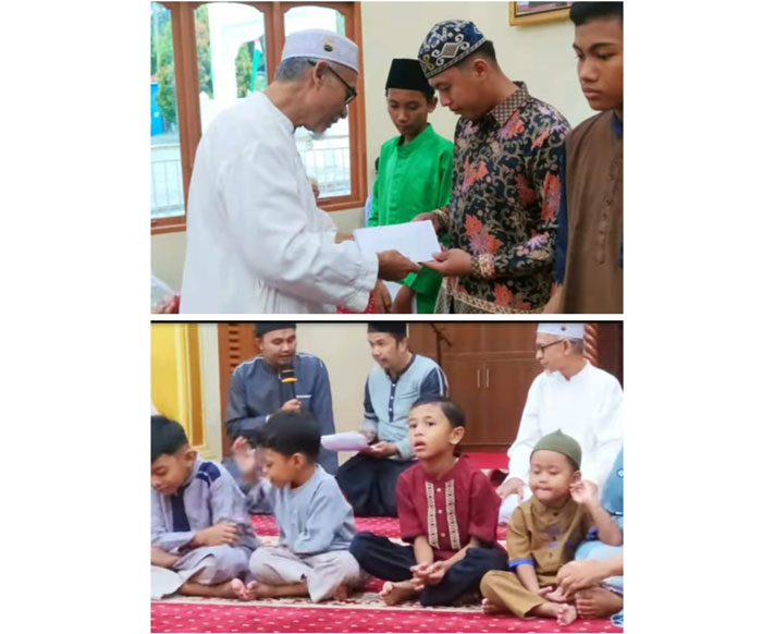 Ketua Pengurus Mesjid Amalmagfirah                                                                                         Drs. H. Ari Syofyan,MM Menyerahkan santunan anak yatim