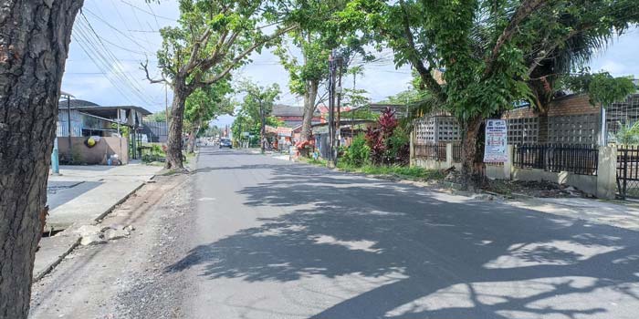 Kondisi Jalan Taman Karya, Kecamatan Tuah Madani sudah kembali mulus setelah dilakukan perbaikan dengan sistem overlay, Selasa (14/5/2024).