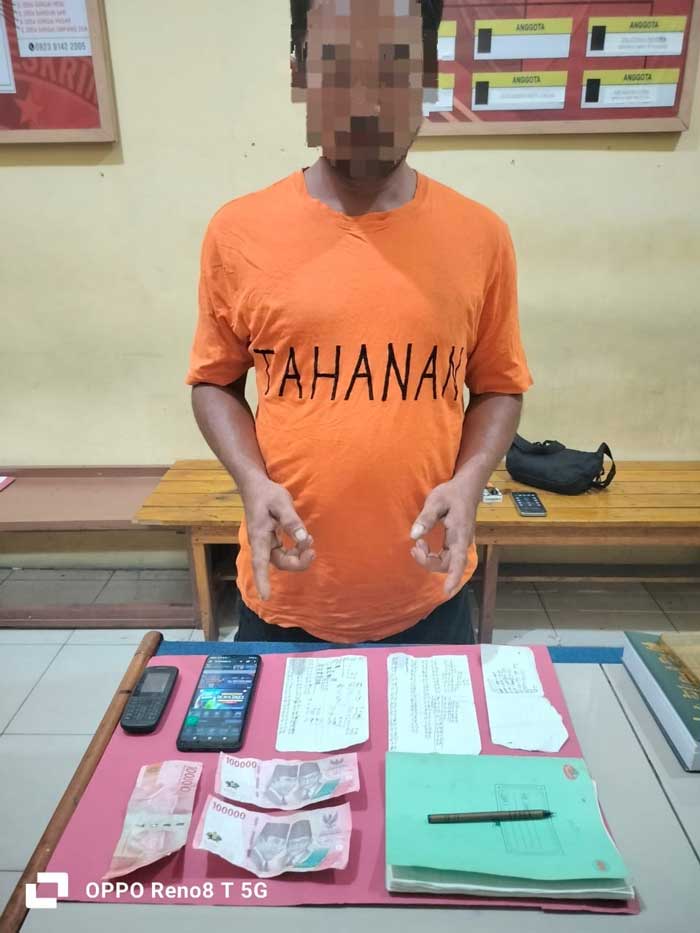Jajaran Polsek Kampar Kiri Hilir berhasil mengamankan seorang pelaku judi togel online, Ahad (9/6/2024)