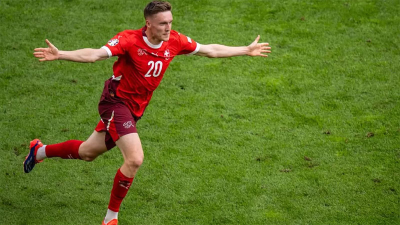 Selebrasi Michel Aebischer usai mencetak gol ke gawang Hungaria.