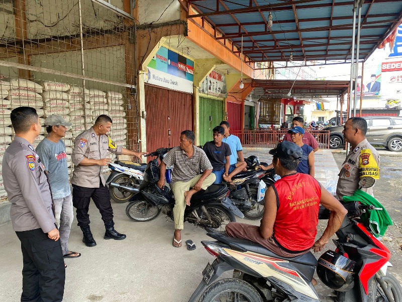 Satgas Preemtif Polres Kuansing cooling system imbau masyarakat jangan golput, Kamis (17/10/2024).