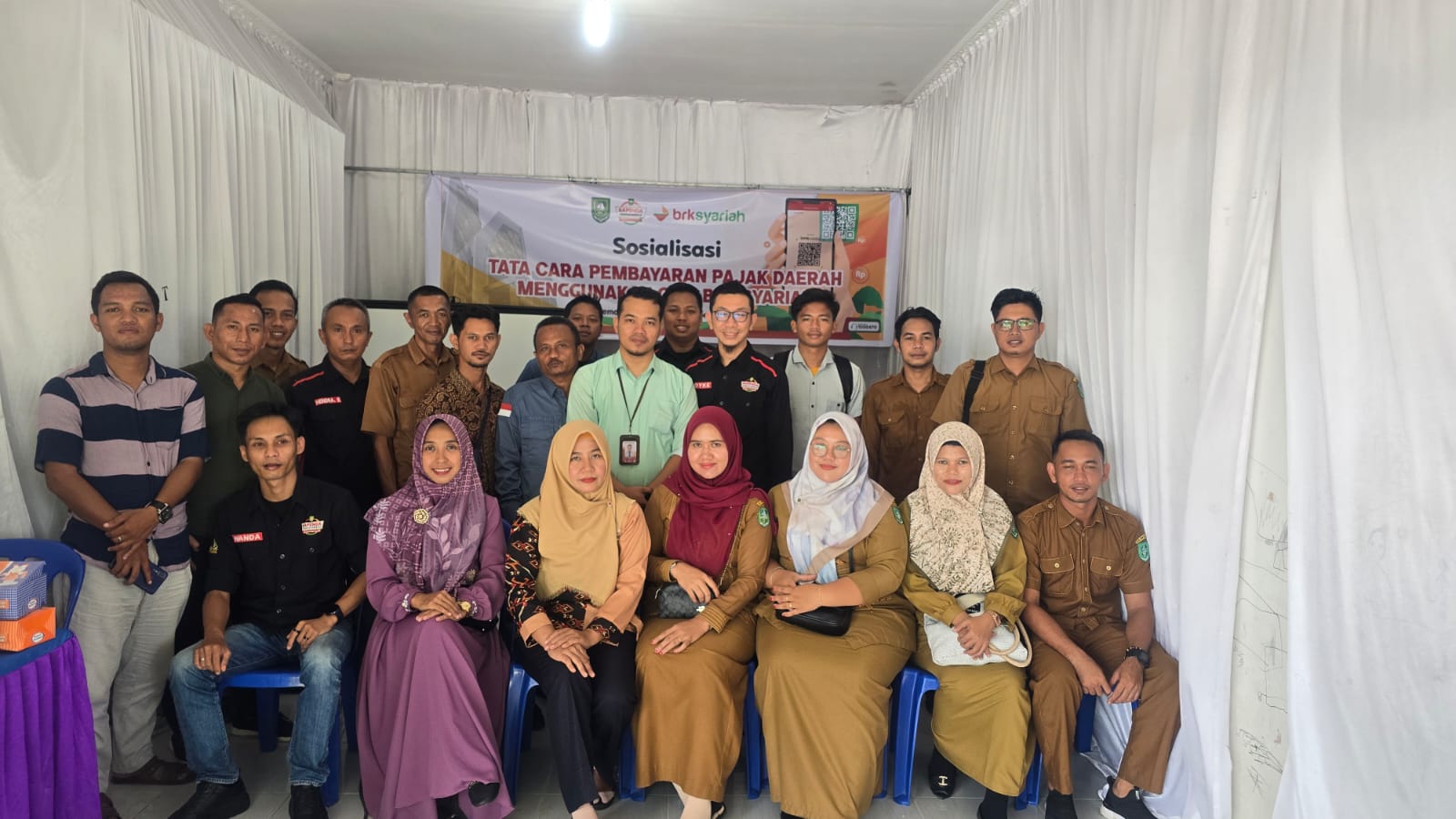 Sinergi Bank Riau Kepri Syariah Bengkalis dengan pemerintah daerah dalam mempermudah masyarakat untuk membayar Pajak Bumi dan Bangunan Perdesaan dan Perkotaan (PBB-P2). Melalui QRIS BRK Syariah