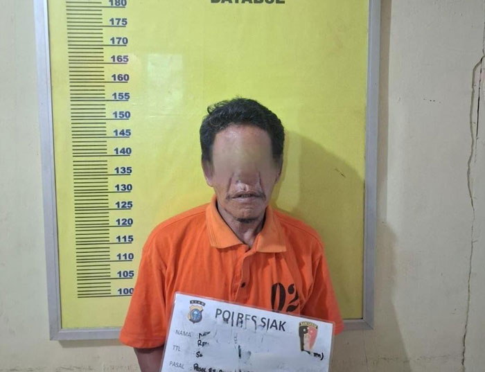Tersangka MS (55) sedang menjalani penyidikan di Polsek Kandis, Selasa (4/3/2025).