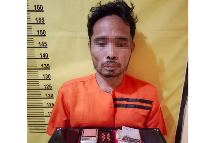 Oknum Ketua RT di Desa Pekan Heran berinisial Mrl alias Bujang, Senin (21/7/2025).