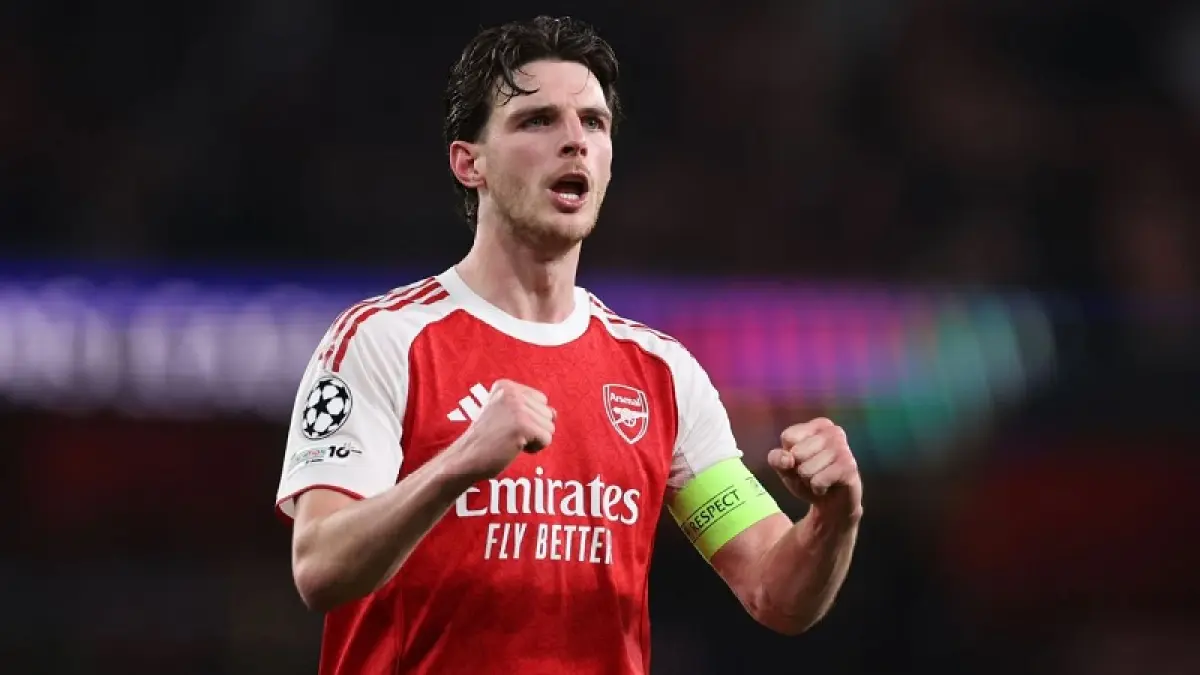 &nbsp;Kapten Arsenal Declan Rice merayakan keberhasilan lolos ke semifinal Liga Champions setelah mengalahkan Sporting CP 1-0 secara agregat di perempat final. (Catherine Ivill - AMA/Getty Images)