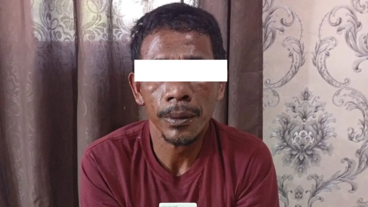 Pelaku saat diamankan di Polsek Rupat Bengkalis. (Istimewa)