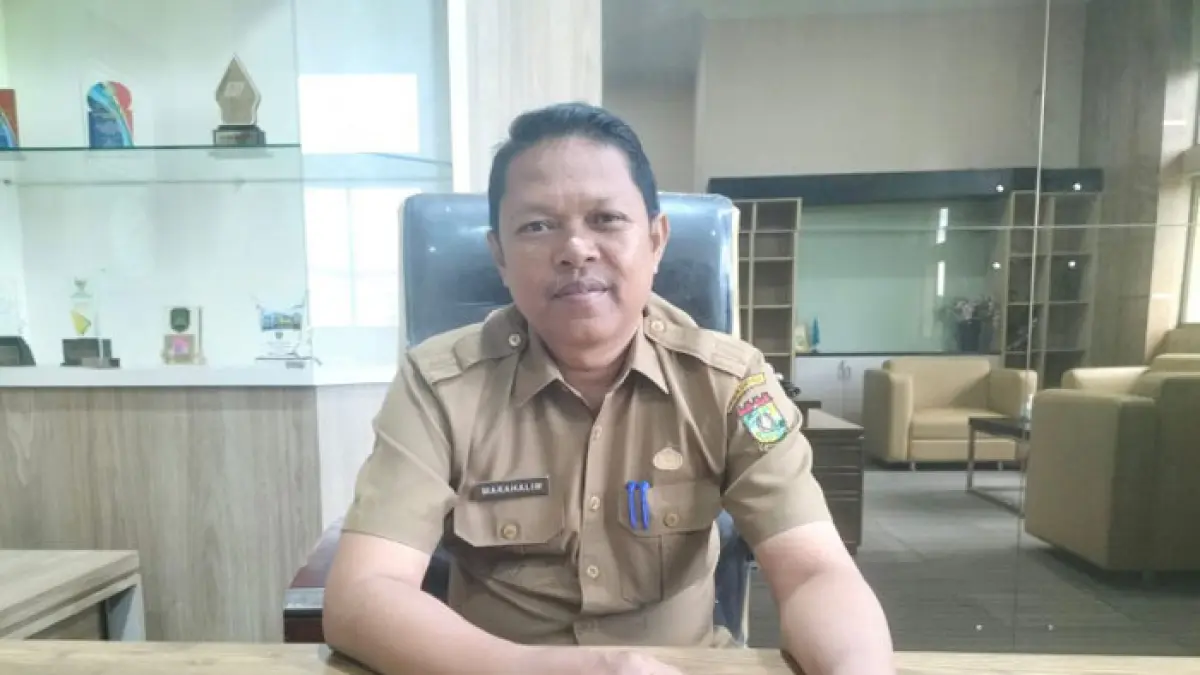 Kepala Disbunnakkeswan Kabupaten Kampar, Marahalim. (Diskominfo Kampar untuk Riaupos.co)