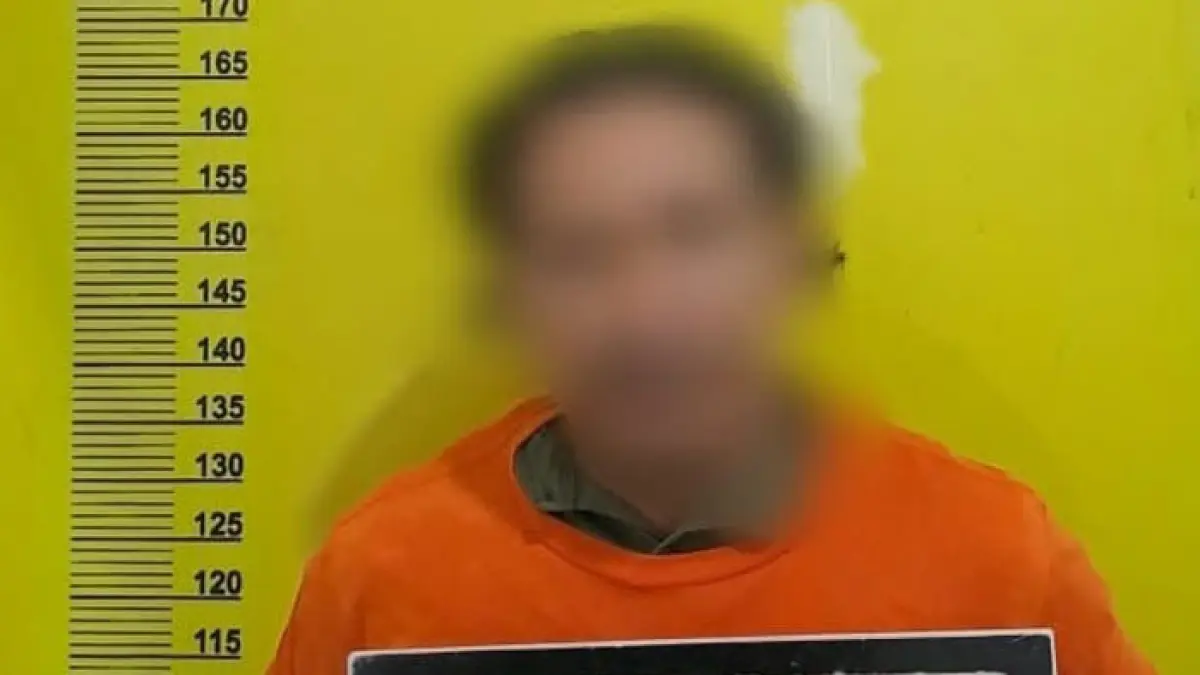 Tersangka JP saat diamankan pihak kepolisian. (Istimewa) 