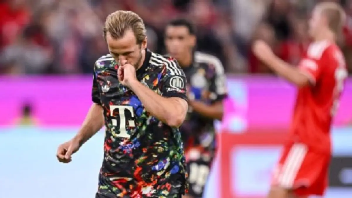 Harry Kane melakukan selebrasi setelah mencetak gol ke-100 di Bundesliga. (Getty Images)