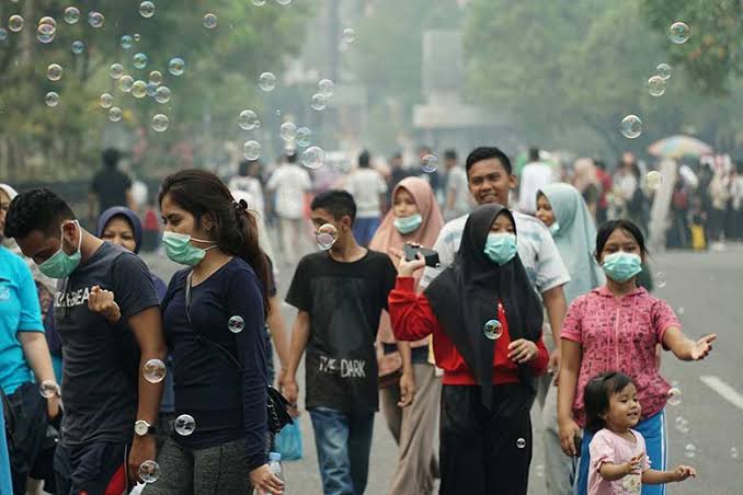 Ilustrasi warga ramai bermasker di pusat keramaian,(DOK.M AKHWAN/RIAUPOS.CO)