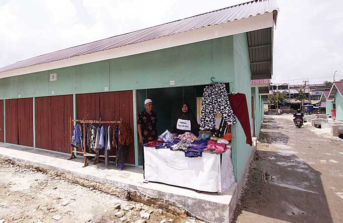 Ratusan kios TPS Pasar Cik Puan belum dihuni pedagang, Selasa (2/5/2023). Ratusan kios ini belum dialiri listrik PLN, karena masih ada tunggakan listrik yang belum dibayar oleh para pedagang.